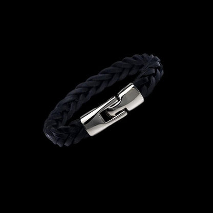 Black braided bracelet with a silver clasp on a black background