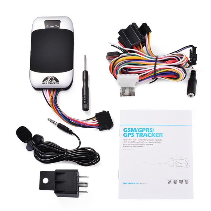GSM/GPS tracker with wiring harness, microphone, and packaging on a white background