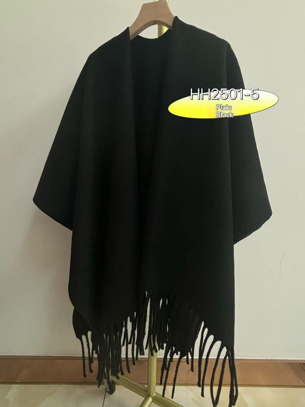Black travel cloak cape with fringed hem and wide draped sleeves