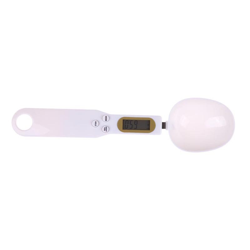 Digital kitchen scale with a white bowl on a white background