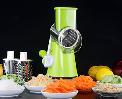 Green manual vegetable spiralizer with sliced vegetables on a black background