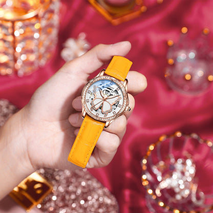 Hand holding a watch with a yellow strap. YAXSO UAE ONLINE STORE