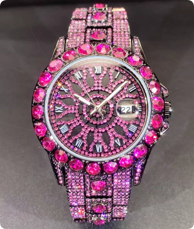 Pink gemstone-encrusted watch on a gray background