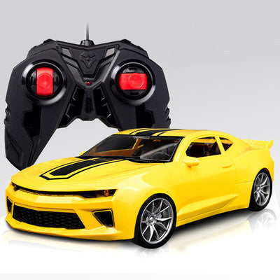 Yellow toy car with a black remote control. YAXSO UAE ONLINE STORE