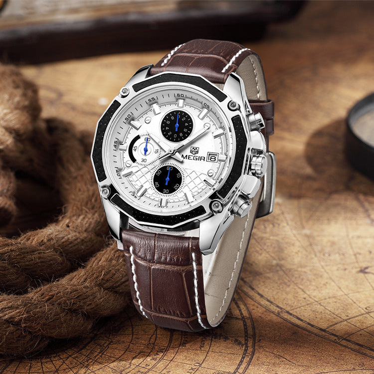 White-dial MEGIR quartz watch with brown stitched strap displayed upright on a map