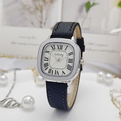 Watch with black strap and silver case on a white background