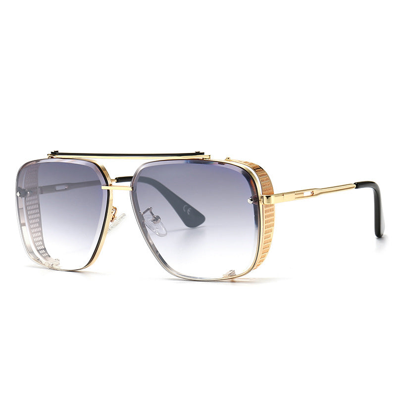 Gold-framed sunglasses with gradient lenses on a white background