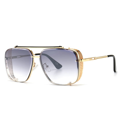 Gold-framed sunglasses with gradient lenses on a white background