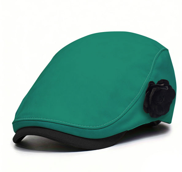 Green fabric beret with small black flower accent and black brim trim.