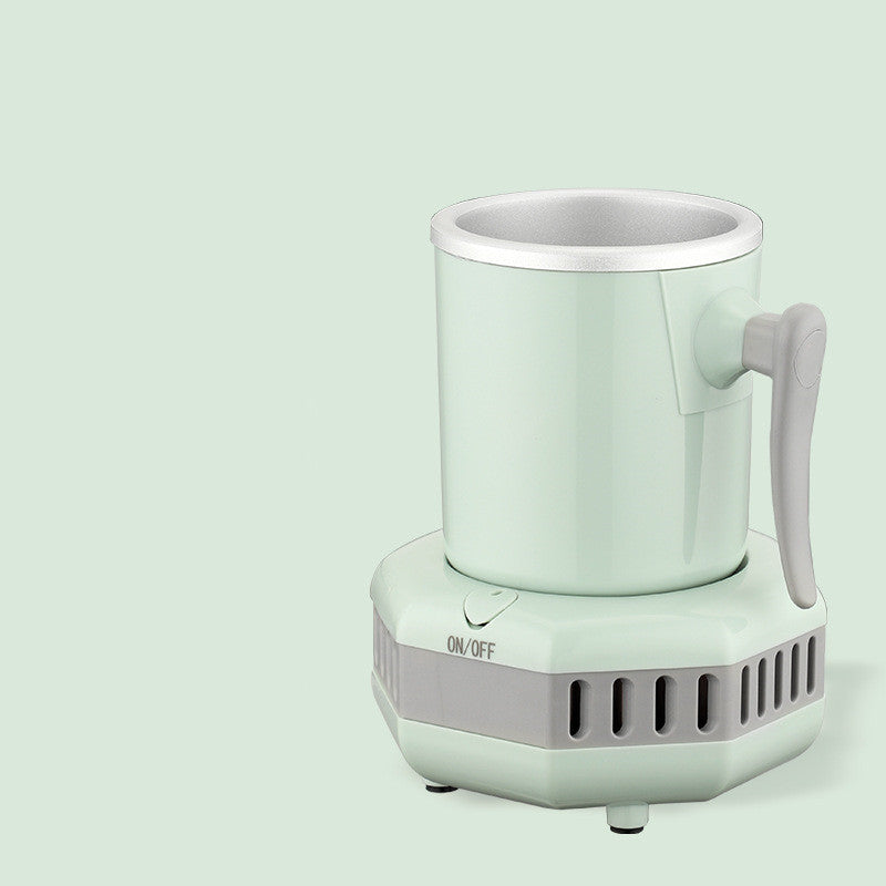 Mint green electric mug cooler with a handle on a light gray background