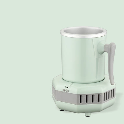 Mint green electric mug cooler with a handle on a light gray background