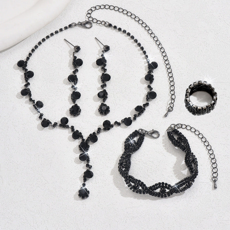 Black crystal necklace, matching earrings, bracelet, and ring jewelry set