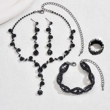 Black crystal necklace, matching earrings, bracelet, and ring jewelry set