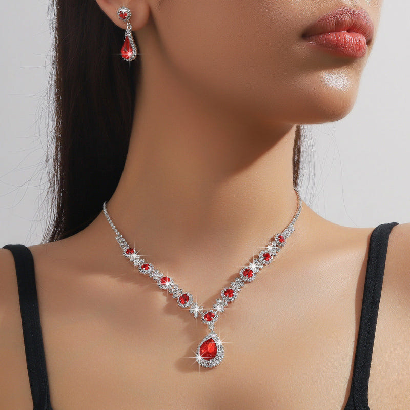 Bridal jewelry set with red crystal drop necklace, teardrop pendant, and earrings