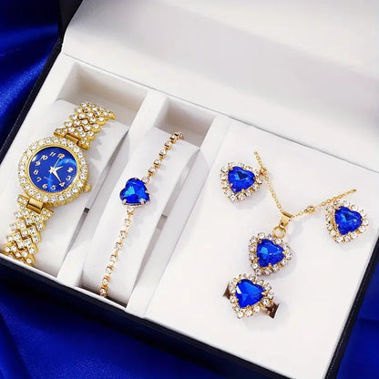 Jewelry set with blue gemstones and gold accents in a box