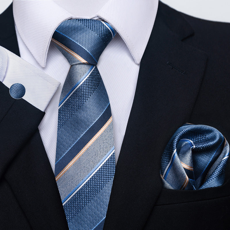 Blue striped tie and matching pocket square with a black suit jacket.