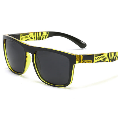Sunglasses with yellow and black frame on a white background