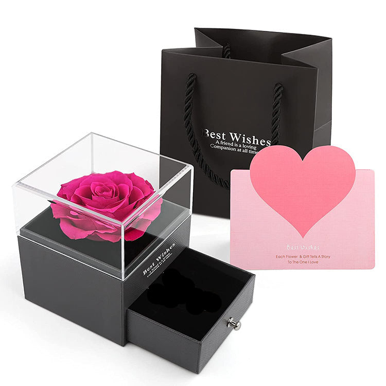 Acrylic jewelry gift box with fuchsia preserved rose in clear cube lid
