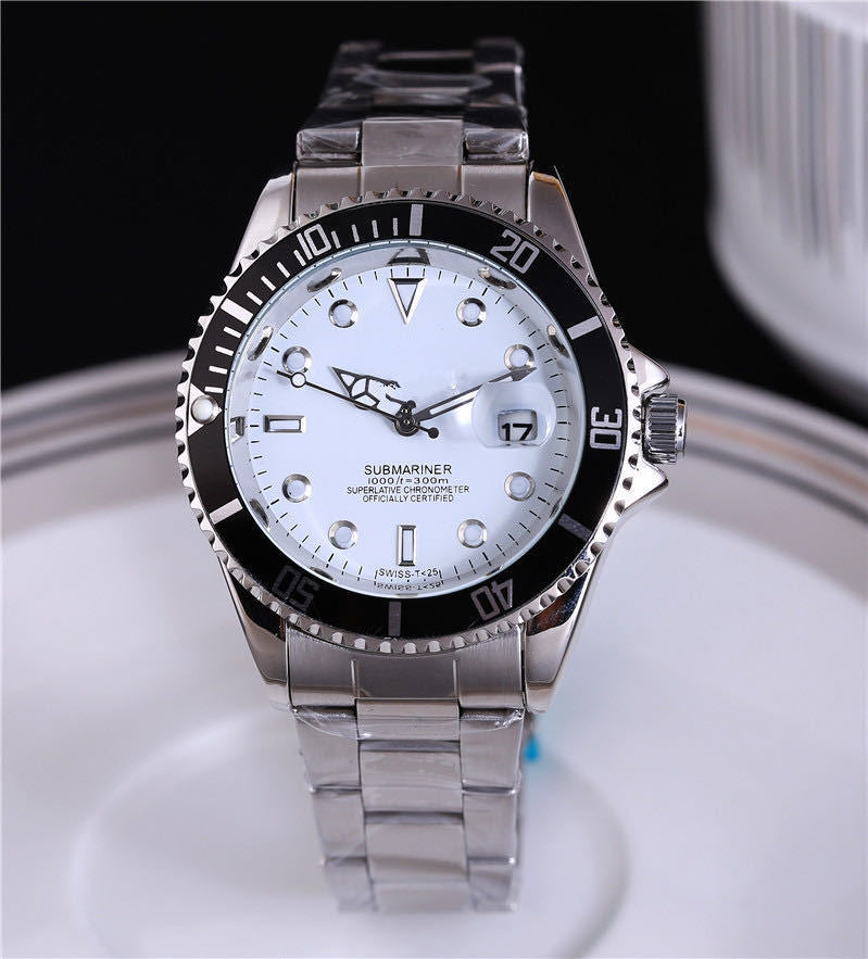 Steel wristwatch with white dial, stainless bracelet, black bezel with minute markers.