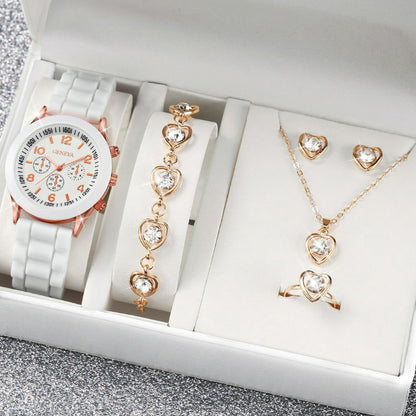 Jewelry set including a watch, bracelet, necklace, and ring in a box.