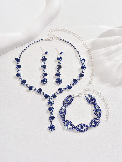 Blue crystal necklace, hoop-style earrings, and heart charm bracelet set
