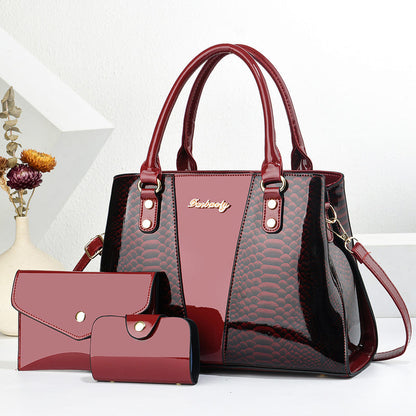 Red shoulder tote bag with scalloped texture, front pocket, and matching wallet set