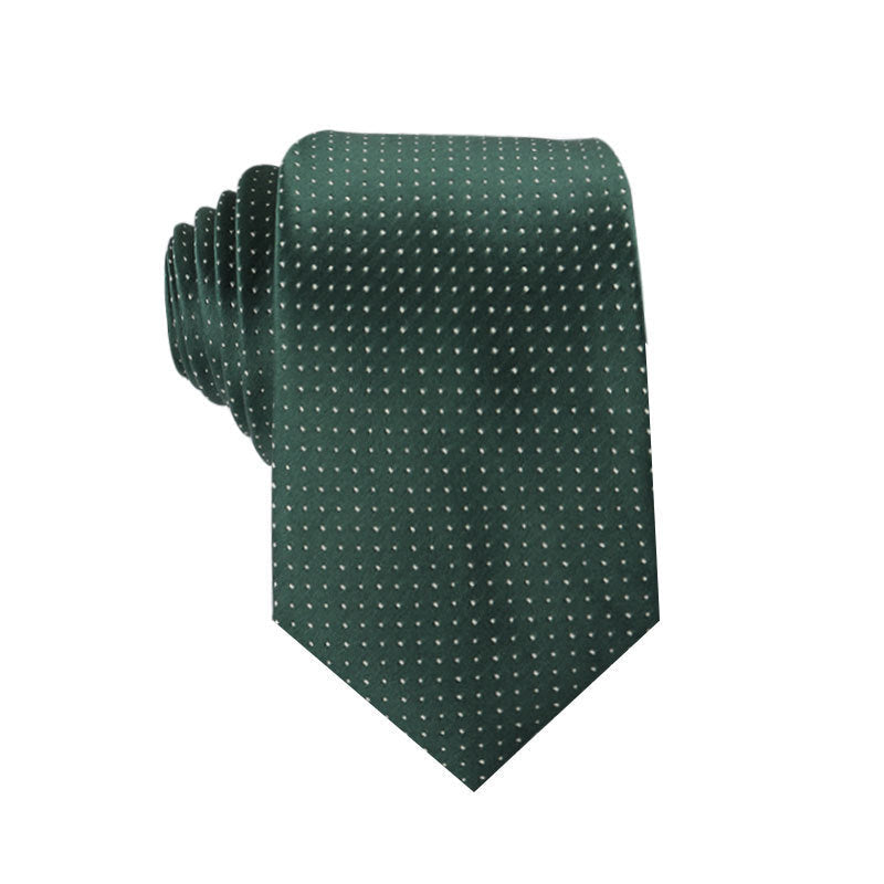 Green tie with white polka dots on a white background