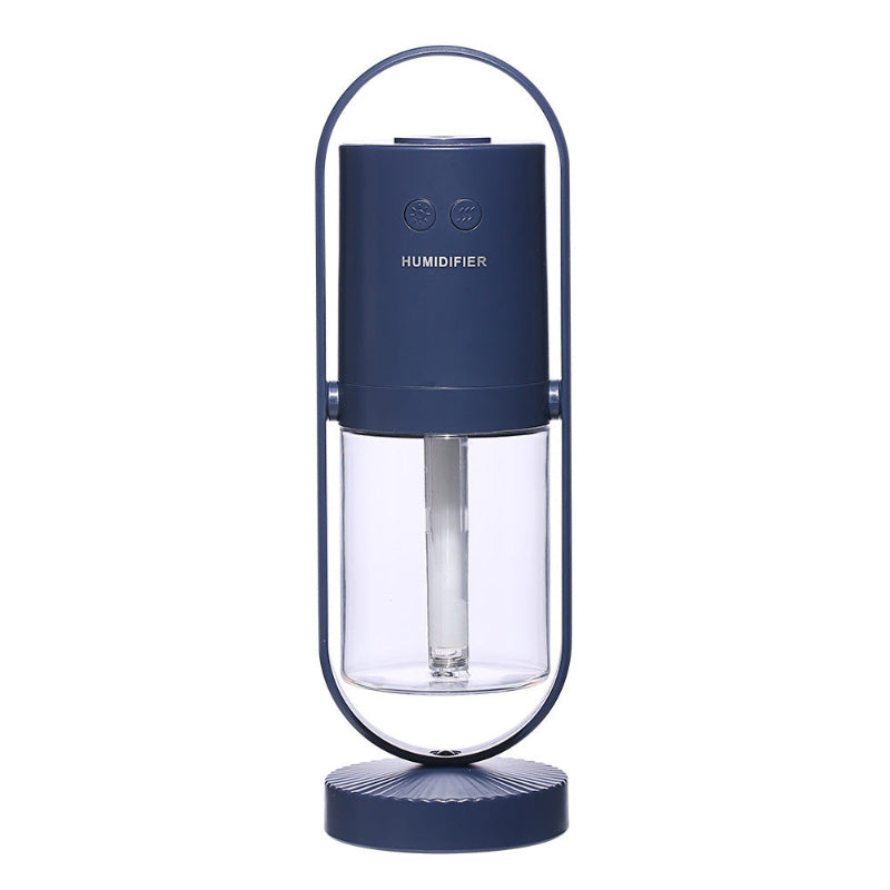 Blue humidifier with clear water tank on a white background