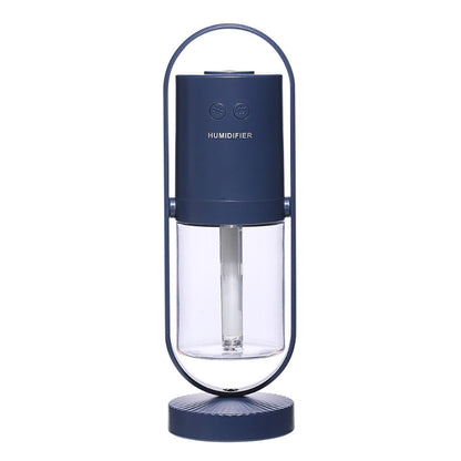 Blue humidifier with clear water tank on a white background