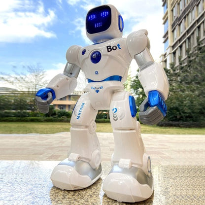 White robot with blue accents on a paved surface with buildings and trees in the background
