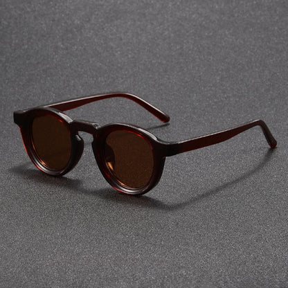 Brown sunglasses on a gray textured background