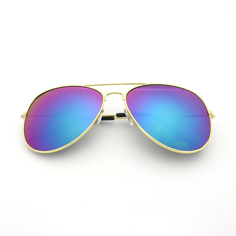 Aviator sunglasses with gold frame and multicolored lenses on a white background