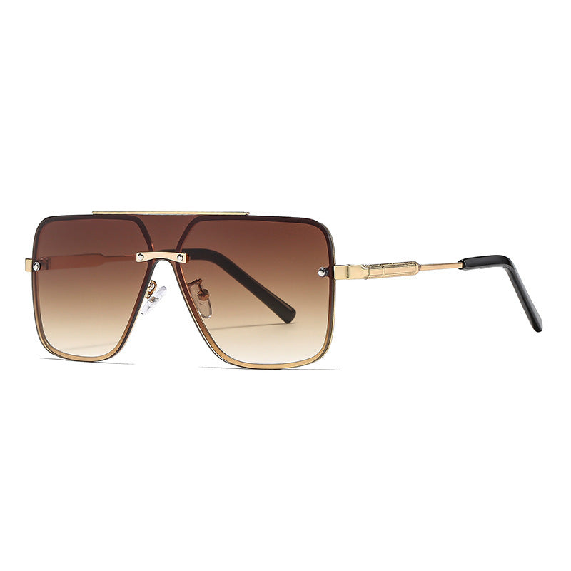 Sunglasses with gold frame and gradient lenses on a white background