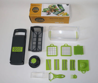 Vegetable slicer kit components laid out, including grater plates and slicer handles