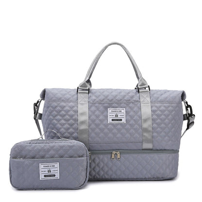 Gray quilted travel bag with front zip and matching crossbody pouch