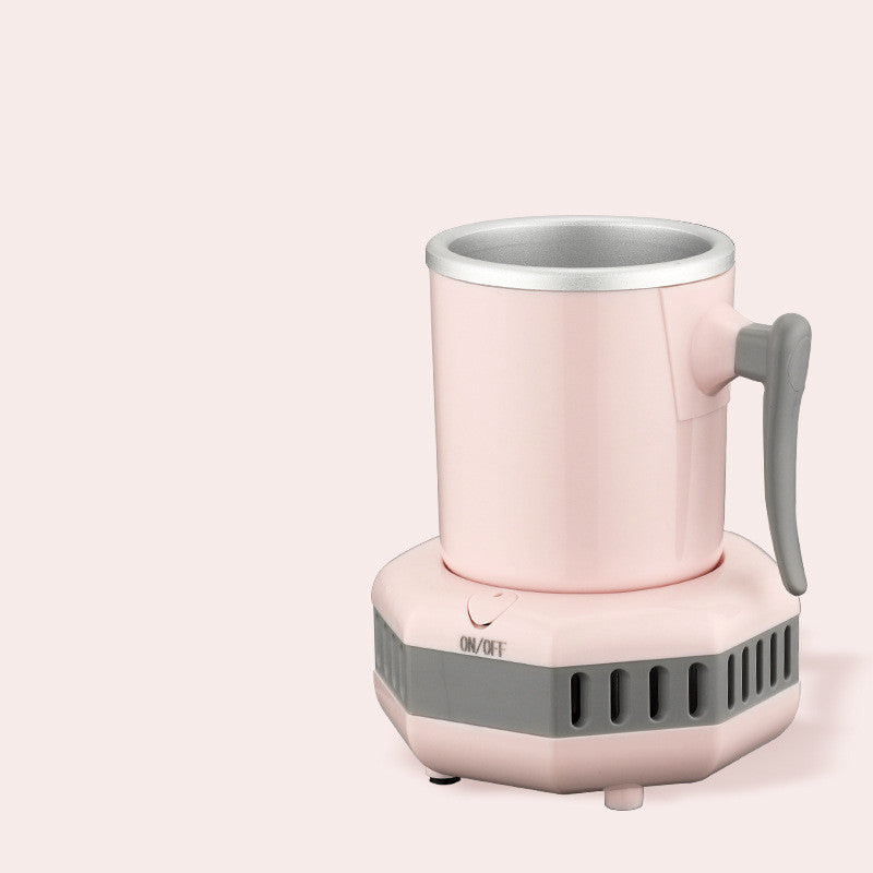 Pink mug with gray handle and base on a light pink background