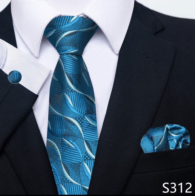 Blue patterned tie and pocket square with black suit and white shirt