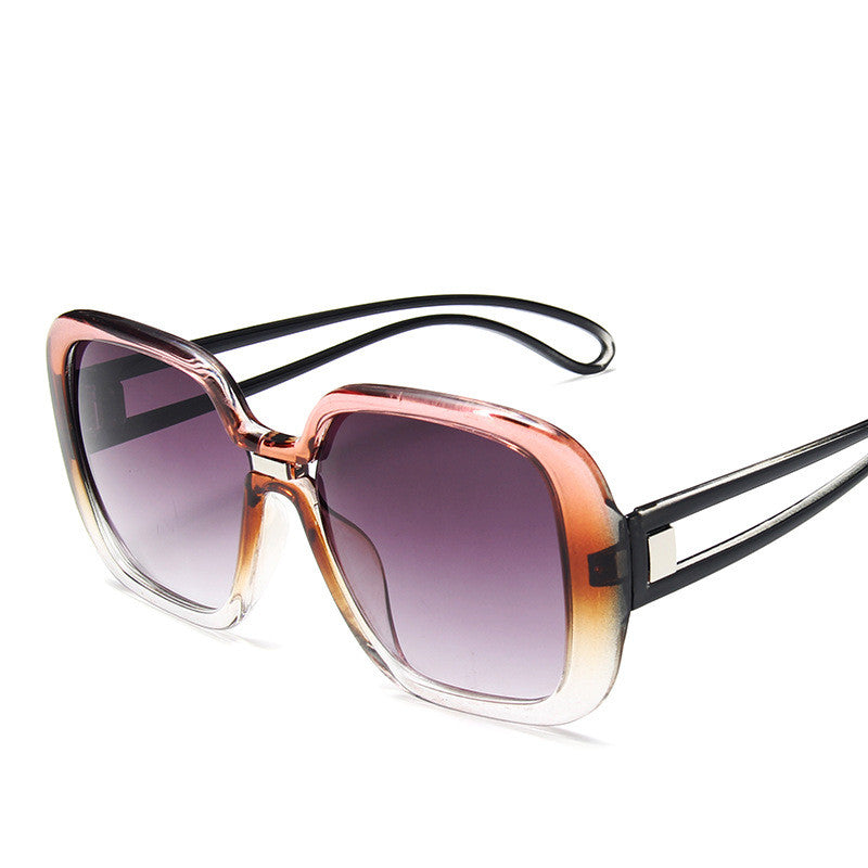 Sunglasses with a gradient purple lens on a white background