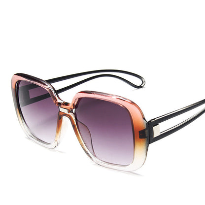 Sunglasses with a gradient purple lens on a white background