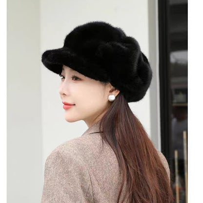 Woman wearing a black fur hat with a neutral background