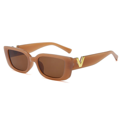Brown sunglasses with a gold logo on a white background