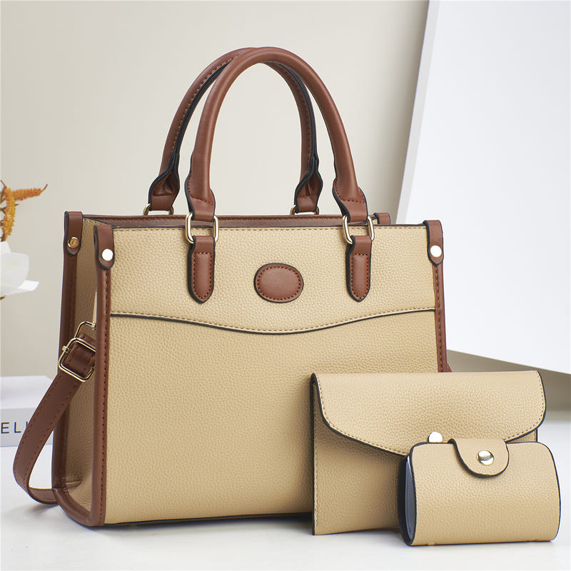 Three-piece shoulder bag set in cream with brown trim: structured tote plus two pouches