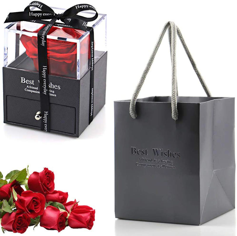Acrylic jewelry gift box with a red preserved rose inside a clear cube and ribbon