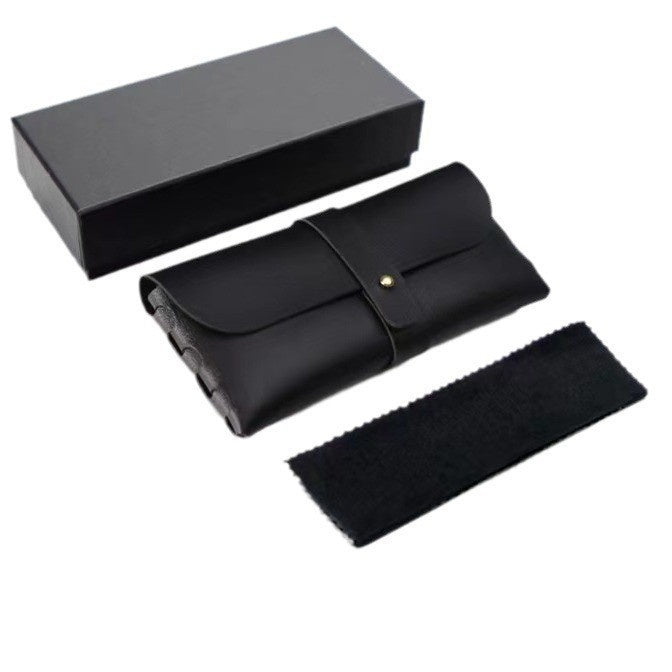 Black leather travel set with a wallet, headband, and box on a white background