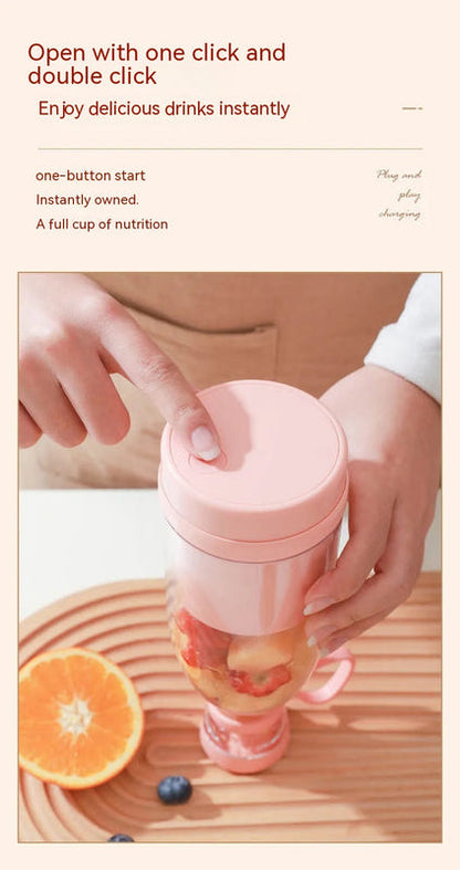 Pink blending cup with lid being closed by hand, with fruit and berries nearby