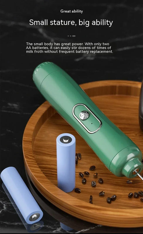 Green electric milk frother and egg beater handheld appliance with whisk head