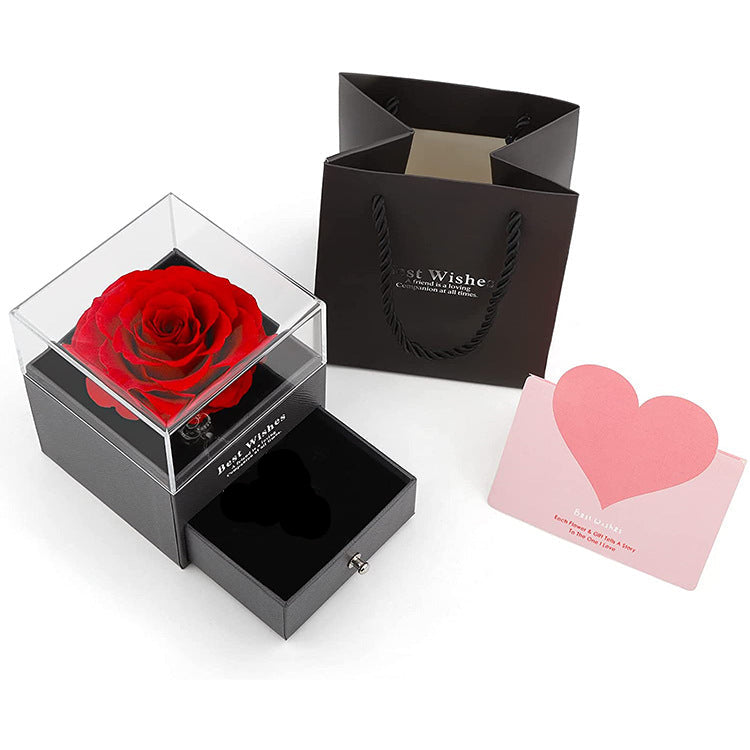 Acrylic jewelry gift box with red preserved rose, open drawer and black insert