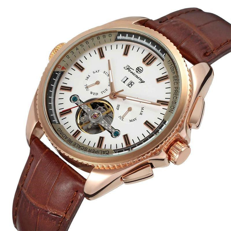 Luxury watch with brown leather strap and rose gold case on white background