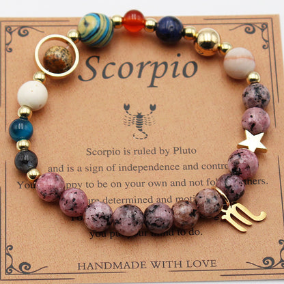 Natural stone bead hemp bracelet with purple speckled stones and gold-tone hand charm