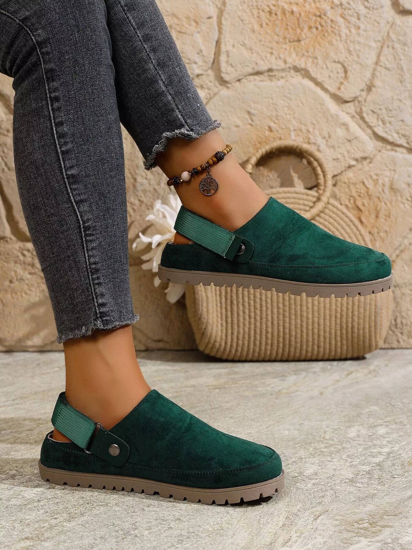 Green round-toe slip-on flats with side strap and textured tread sole